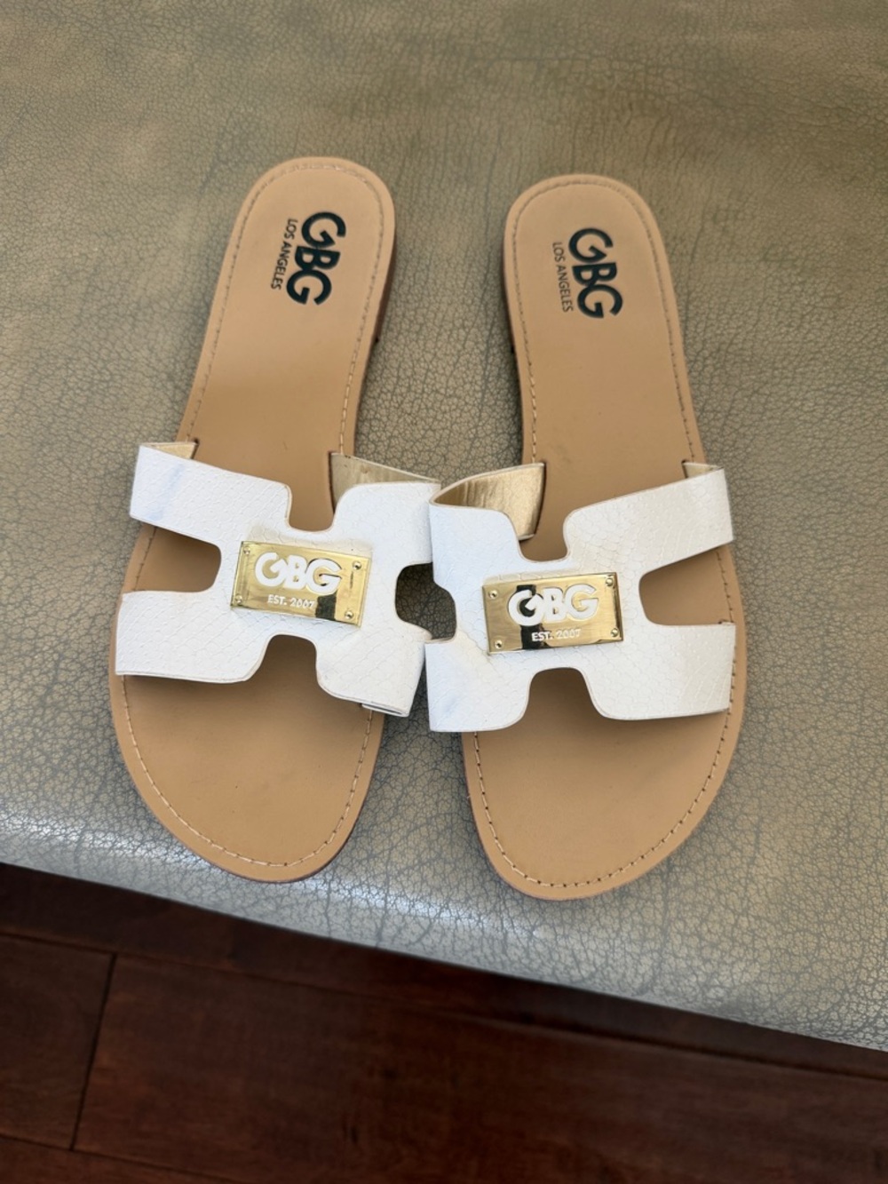 GBG Los Angeles White Slide Sandals with Gold Logo Plaque